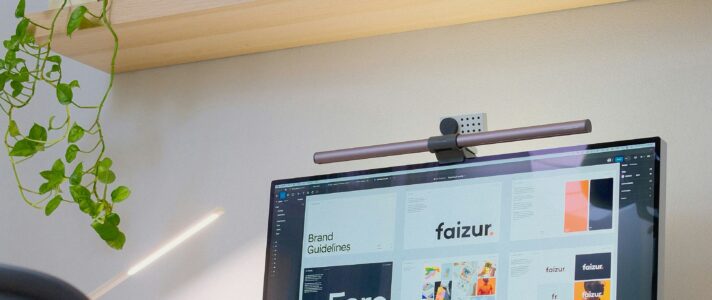 Website designers planning a redesign strategy with small business owner